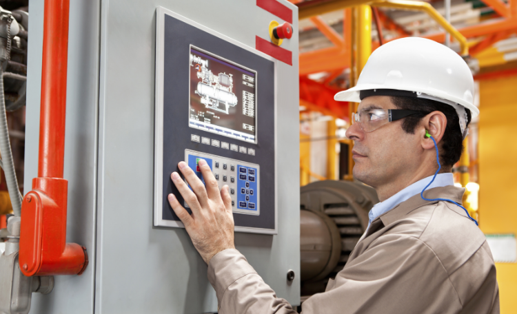 Worker using HMI on Control Panel