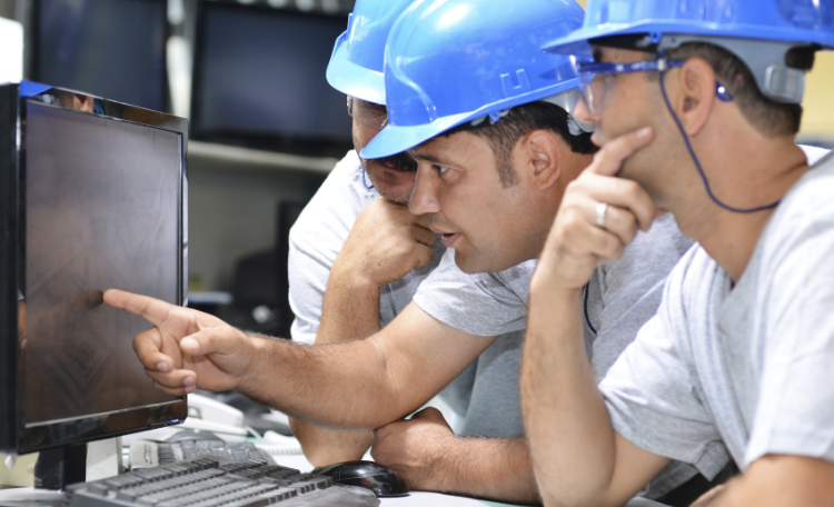 Technicians Looking at Computer Monitor